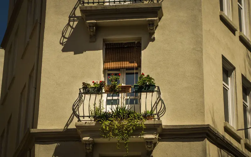 A picturesque balcony adorned with flowers and plants in sunlight, Istanbul
